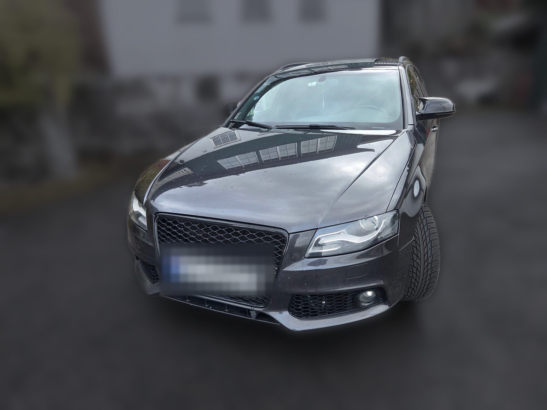 Grå Audi A4 Avant B8 sett forfra
